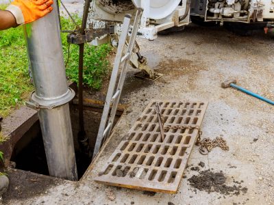 Sewage industrial cleaning truck clean blockage in a sewer line.